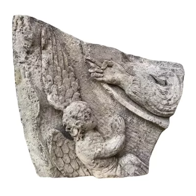 Fragment of a Gothic tympanum. Angel of the Last Judgment. Main view of the sculpture