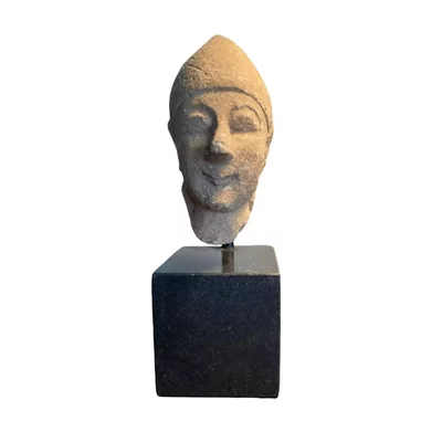 Cypriot head of a male votary. Archaic Cyprus. Beardless male wearing a conical helmet. View number 4